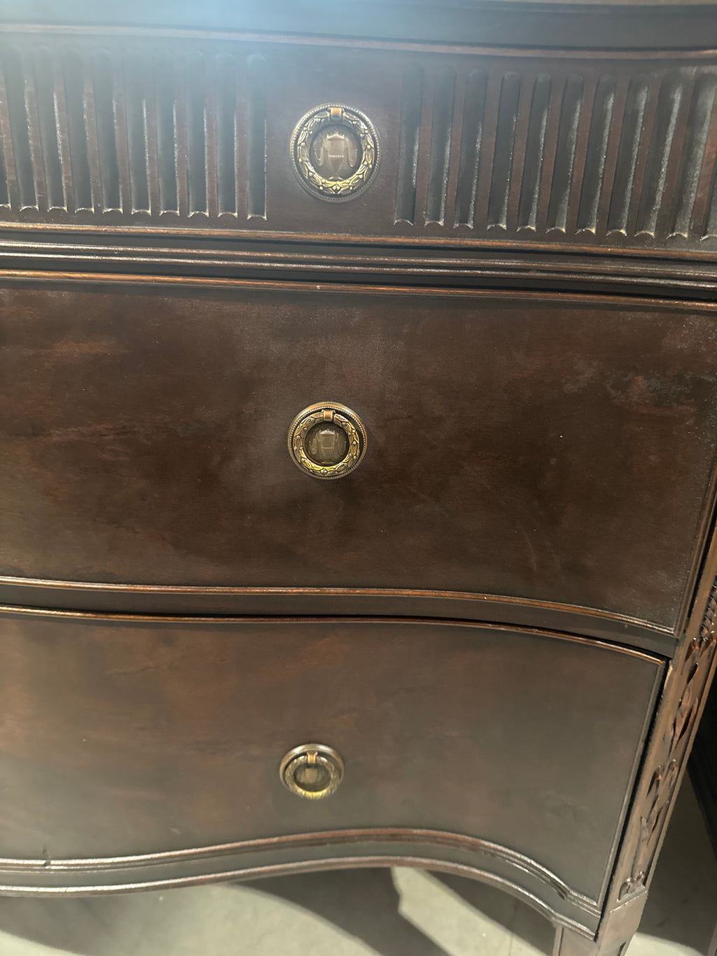 Vintage Baroque-Style Chest of Drawers featuring Ornate Wood Carvings and Brass Pulls.