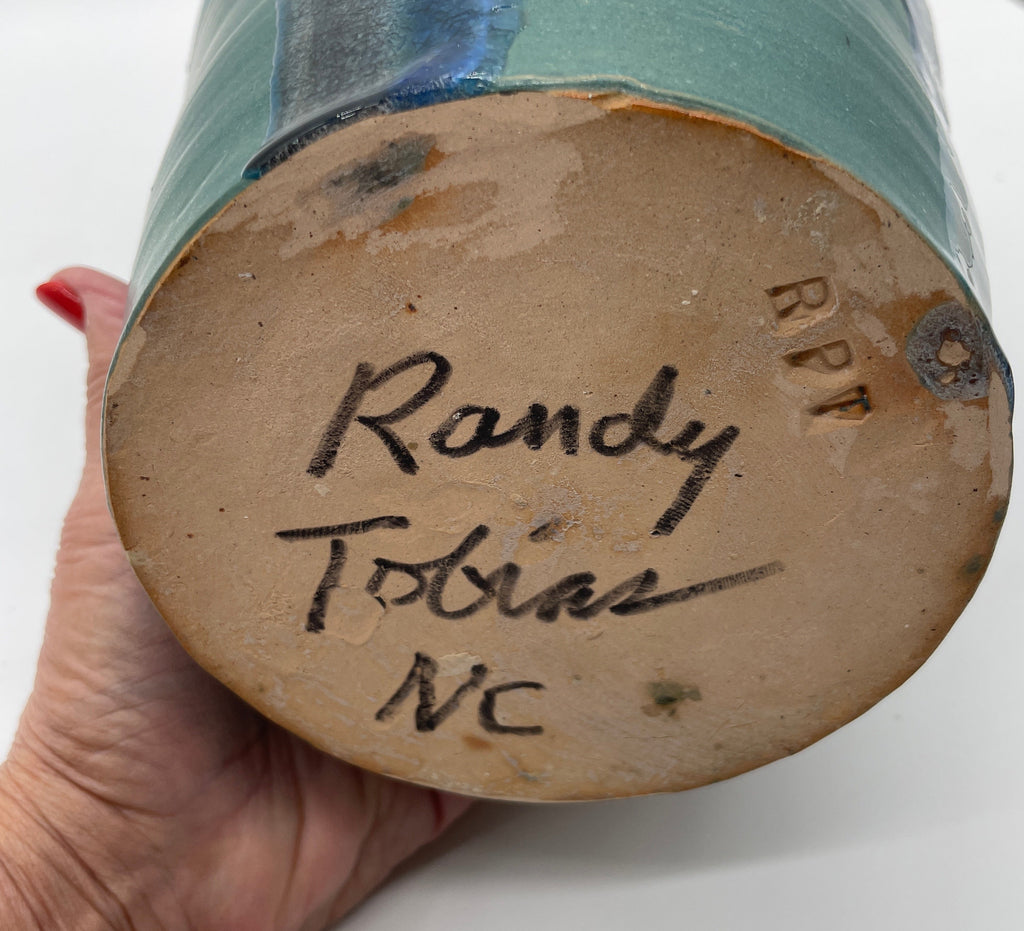 Randy Tobias Folk Art Pottery North Carolina “Crying Eyes Blue Man” signed on bottom.