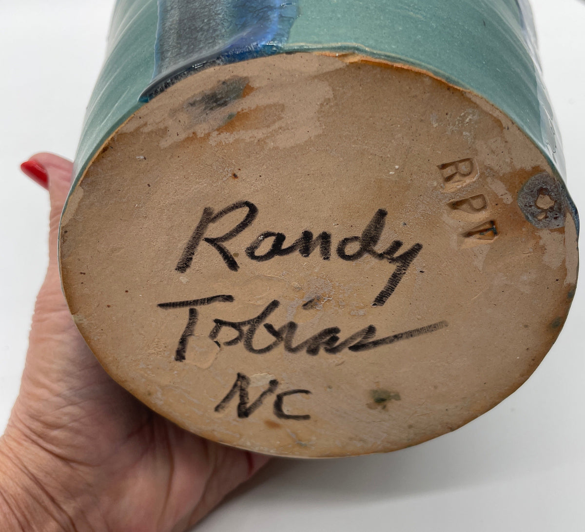 Randy Tobias Folk Art Pottery North Carolina “Crying Eyes Blue Man” signed on bottom.