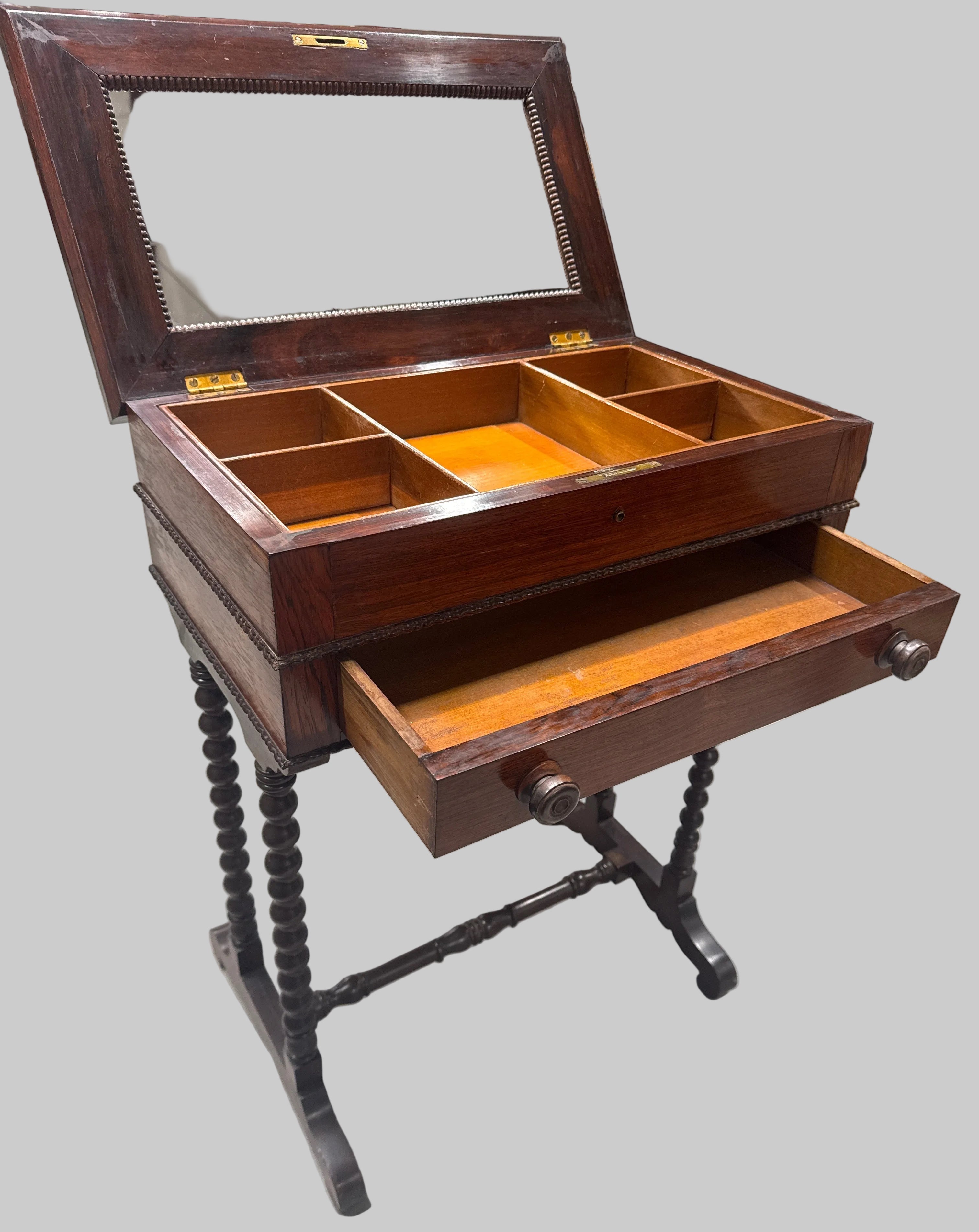 Antique 19th-Century Mahogany Sewing Table with a Flip-Top Mirror and Compartmentalized Interior.