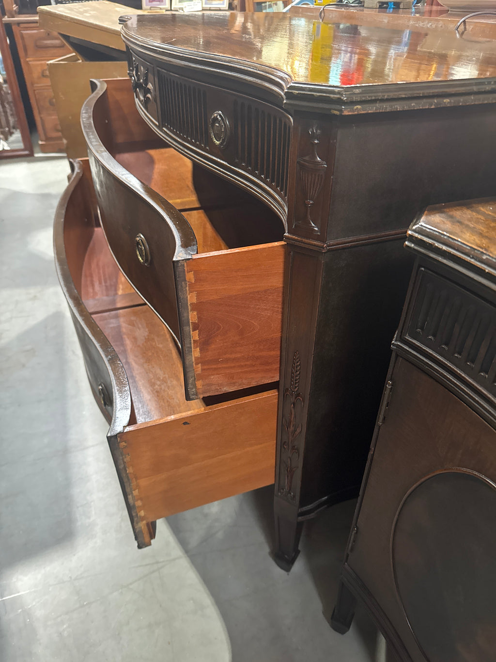 Vintage Baroque-Style Chest of Drawers featuring Ornate Wood Carvings and Brass Pulls.