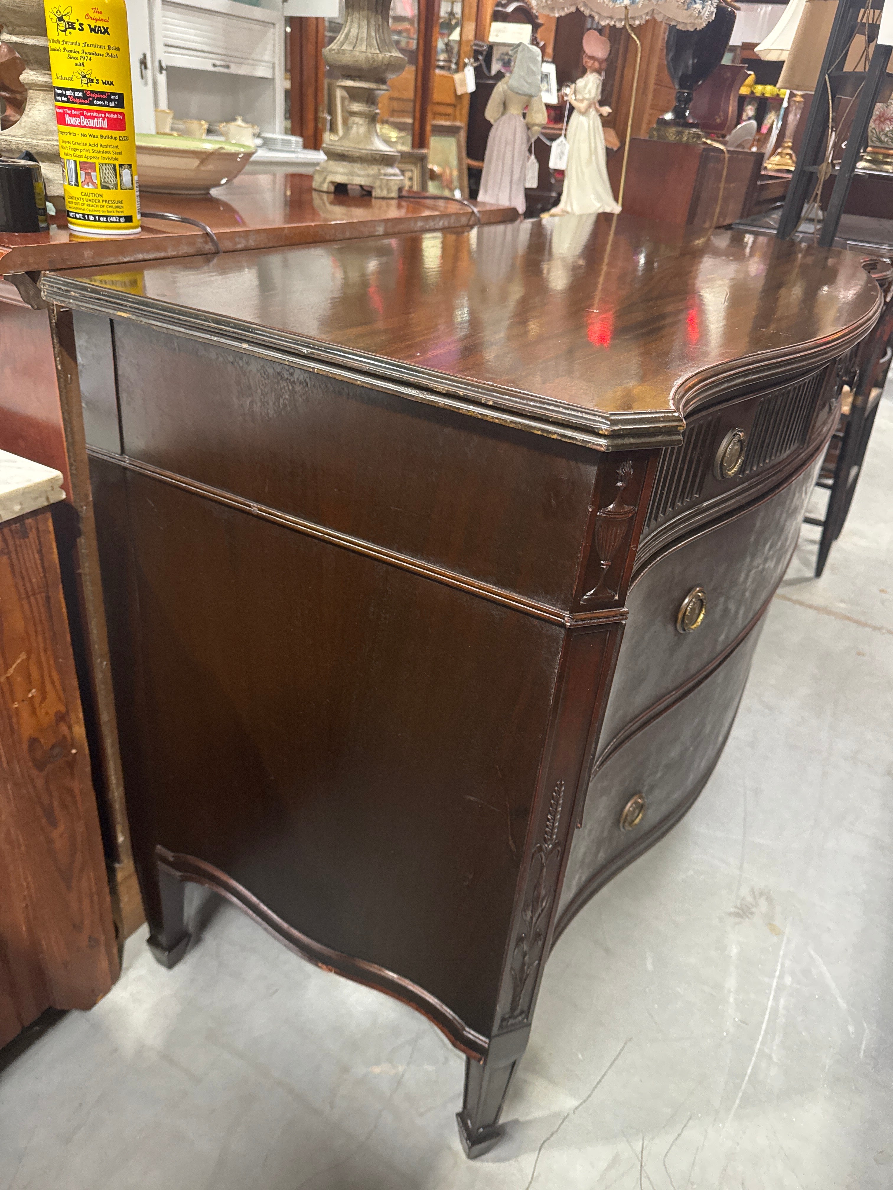 Vintage Baroque-Style Chest of Drawers featuring Ornate Wood Carvings and Brass Pulls.