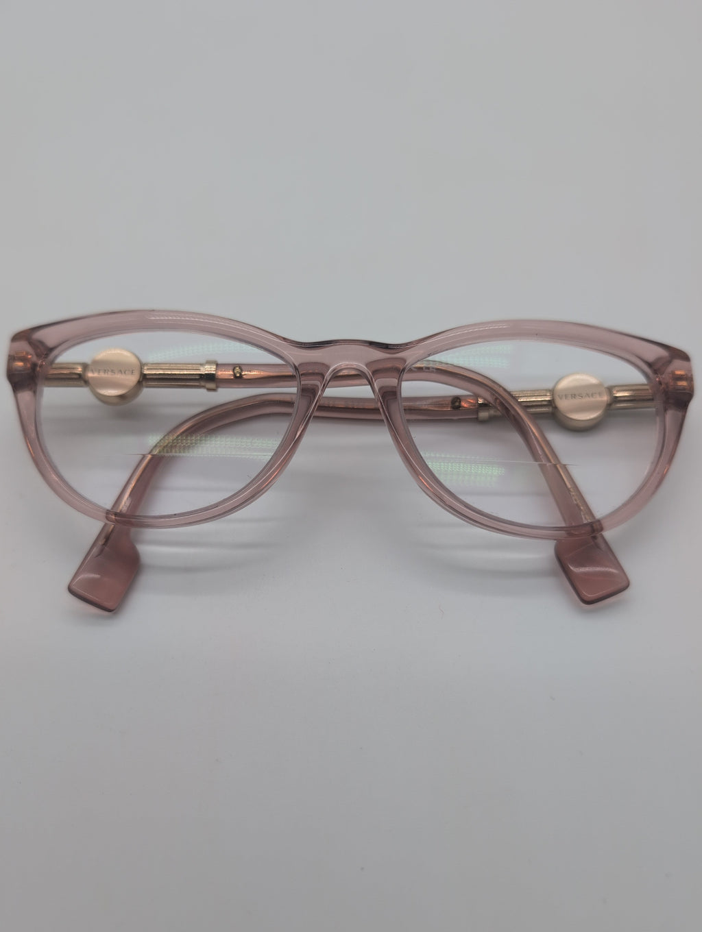 Versace, Model VE3311, Cat Eye Reading Glasses in Transparent Pink with Gold Accented Temples. Bifocal Lenses with Unknown Prescription.