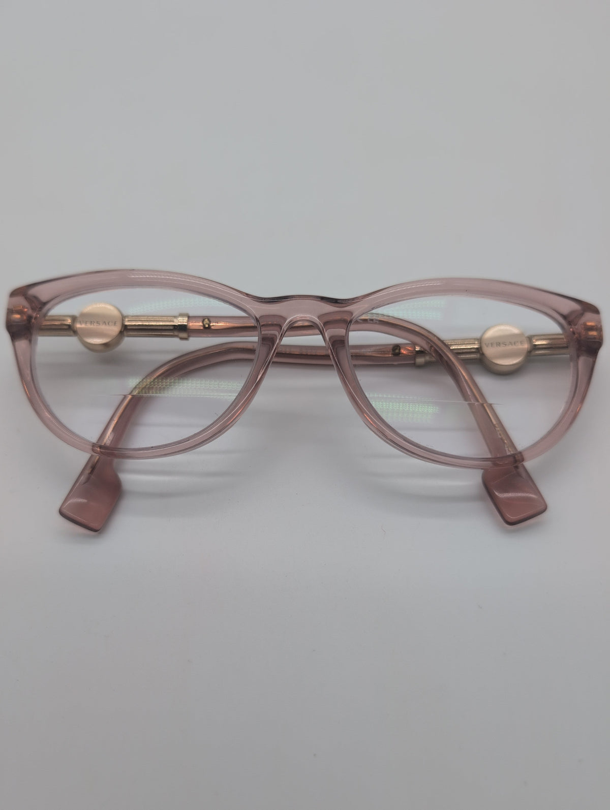 Versace, Model VE3311, Cat Eye Reading Glasses in Transparent Pink with Gold Accented Temples. Bifocal Lenses with Unknown Prescription.