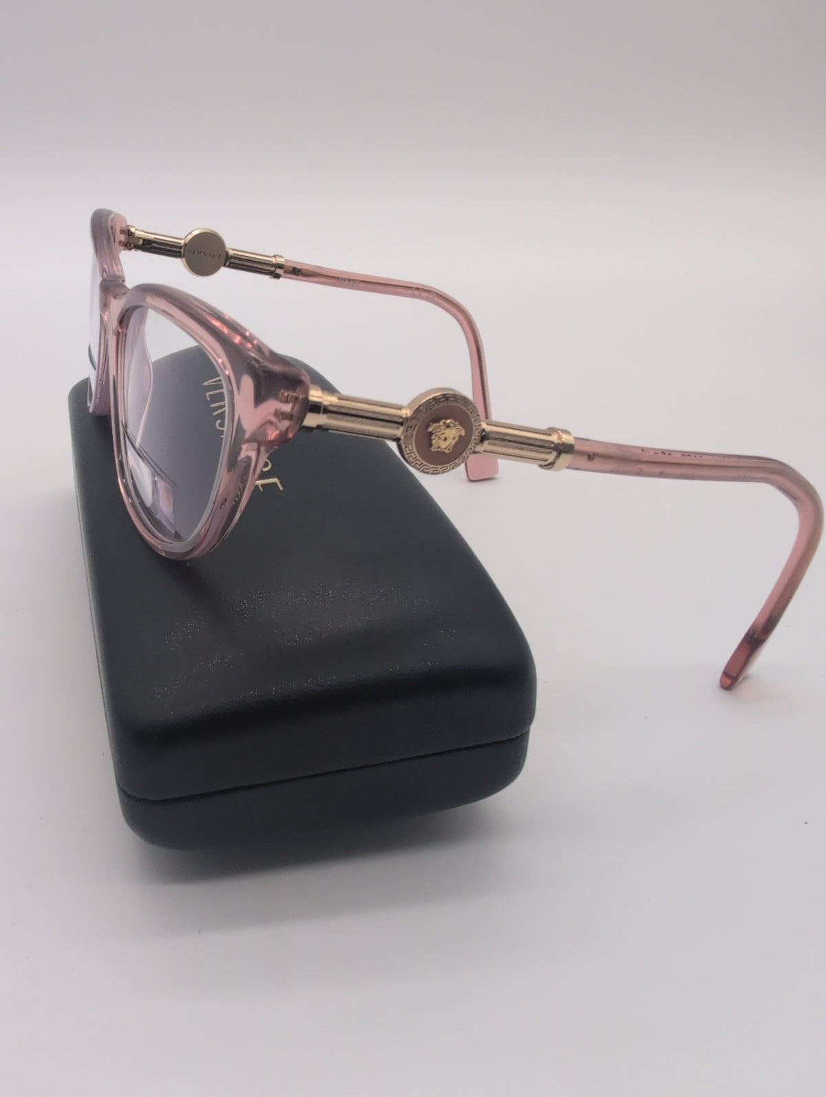 Versace, Model VE3311, Cat Eye Reading Glasses in Transparent Pink with Gold Accented Temples. Bifocal Lenses with Unknown Prescription.