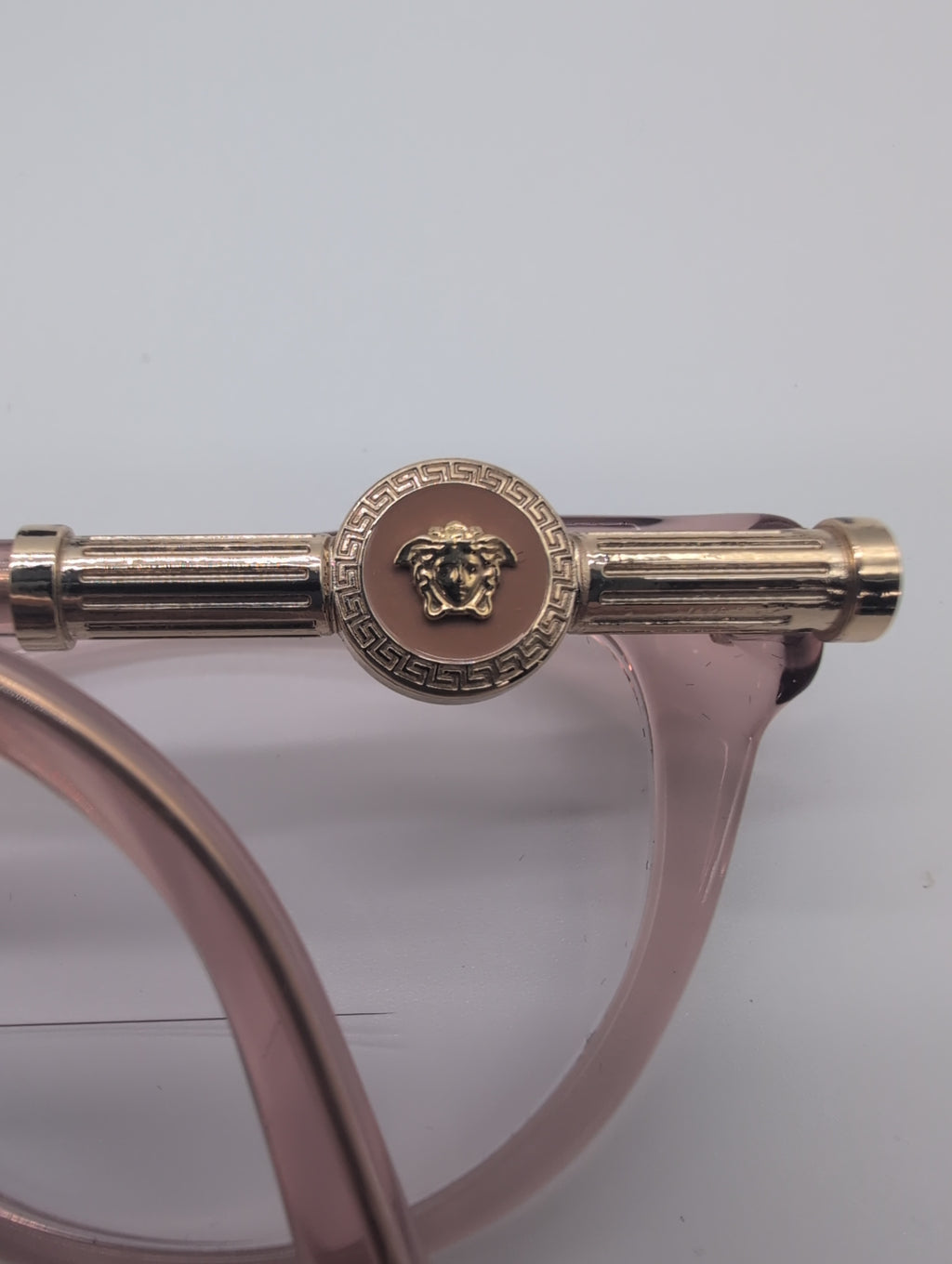 Versace, Model VE3311, Cat Eye Reading Glasses in Transparent Pink with Gold Accented Temples. Bifocal Lenses with Unknown Prescription.