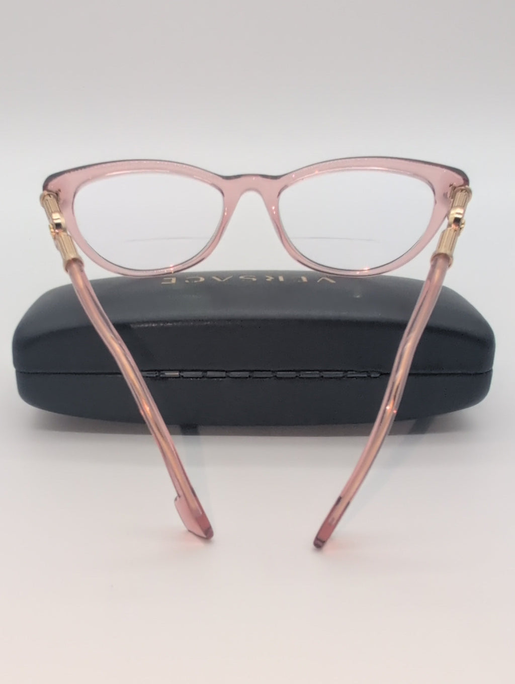 Versace, Model VE3311, Cat Eye Reading Glasses in Transparent Pink with Gold Accented Temples. Bifocal Lenses with Unknown Prescription.